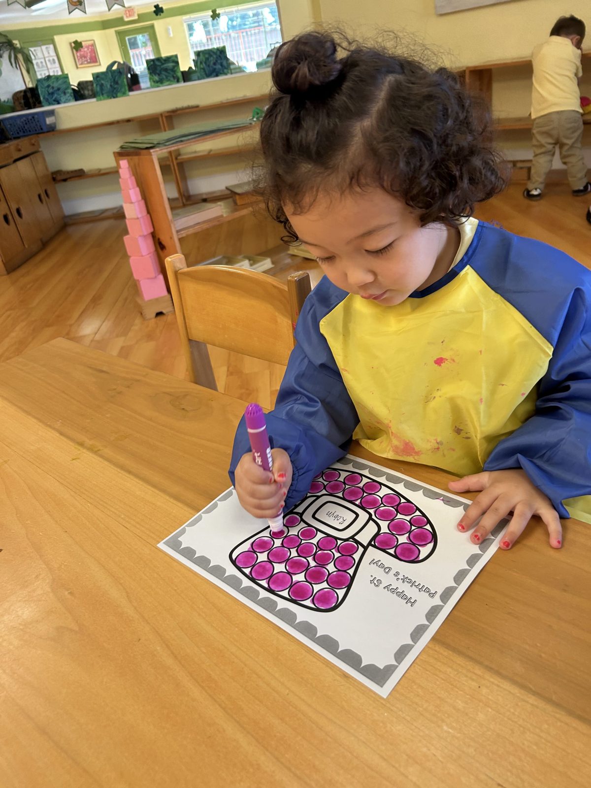 Child concentrating on Montessori work