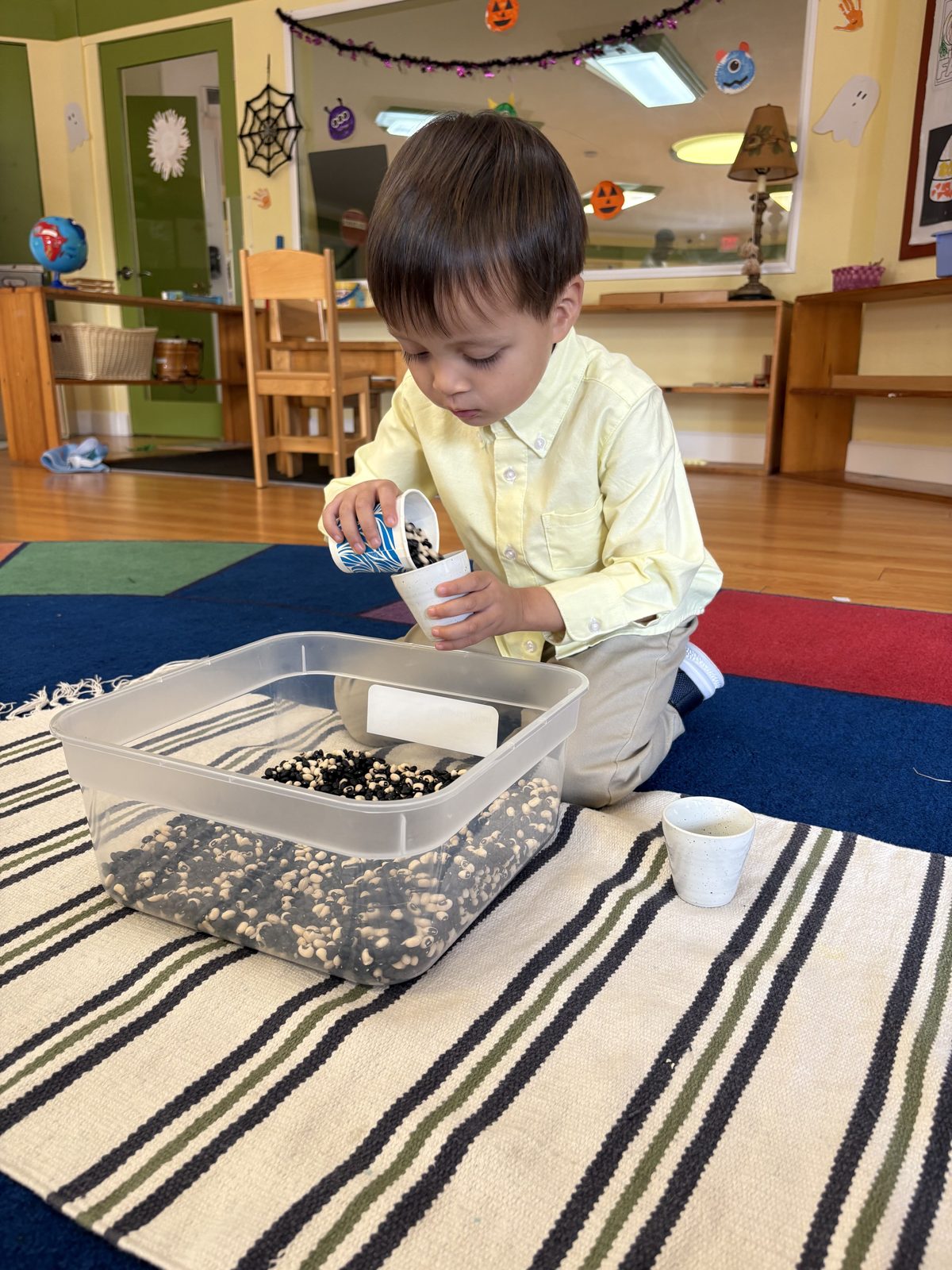 Child measuring and scooping — hands-on STEAM